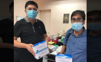 Iloilo City councilor Romel Duron (left) handing out boxes of face masks to Raymundo 'Boyet' Parcon, representing the drivers' associations in Iloilo City.